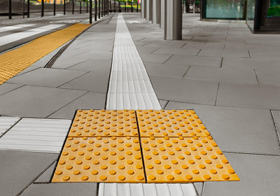 Surface mounted tactile paving on public walkway